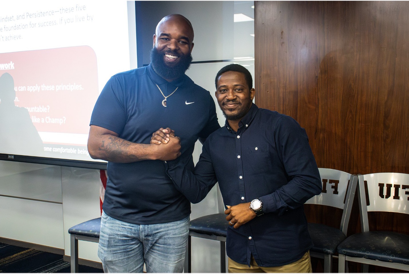 Sly Williams with student Mivheal Tetteh at FIU’s Men of Character Leadership Symposium